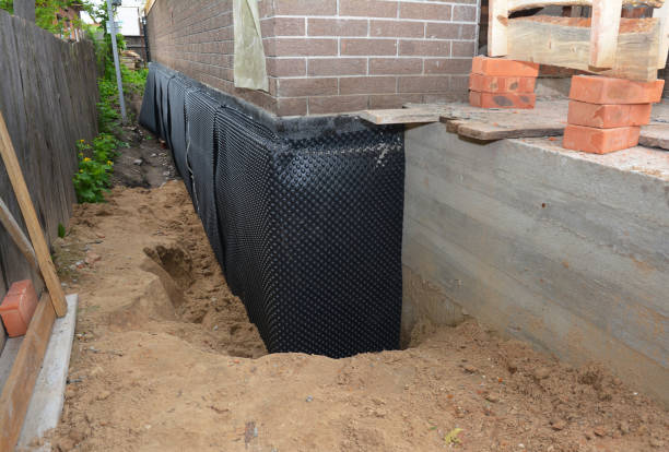 Happy homeowners after waterproofing job in Garden City